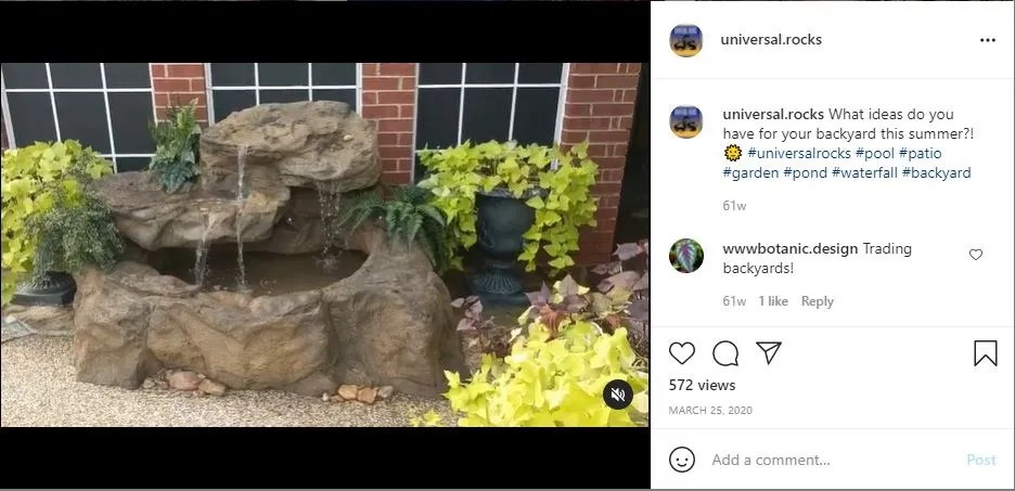 Molded concrete waterfall with plants around