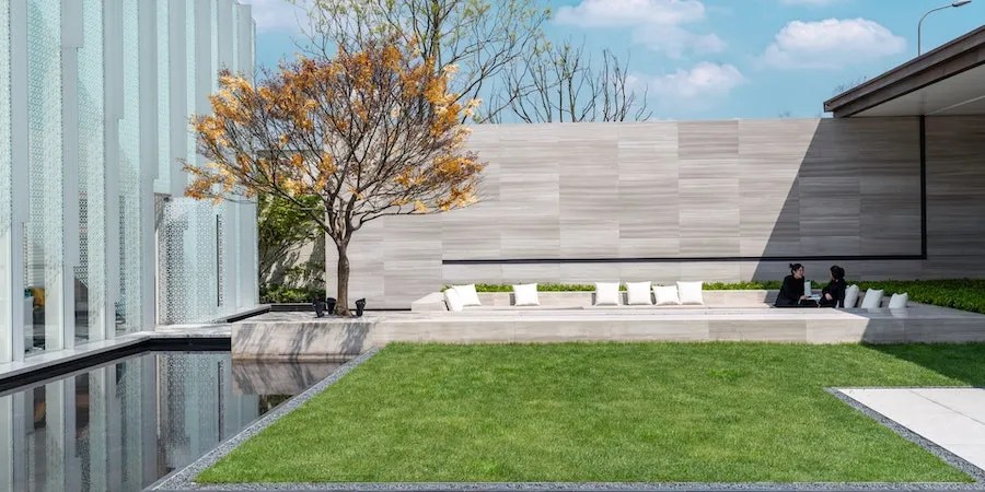 People Sitting Near Artificial Lawn