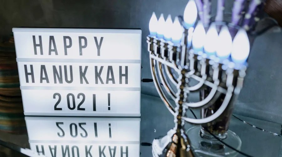 Photo Of Sign Board Near Candle Holder