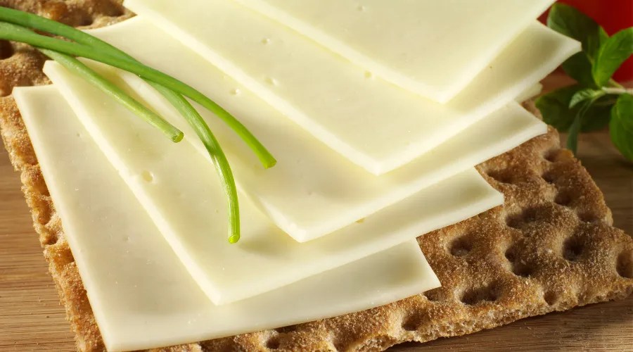 sliced cheese on cracker