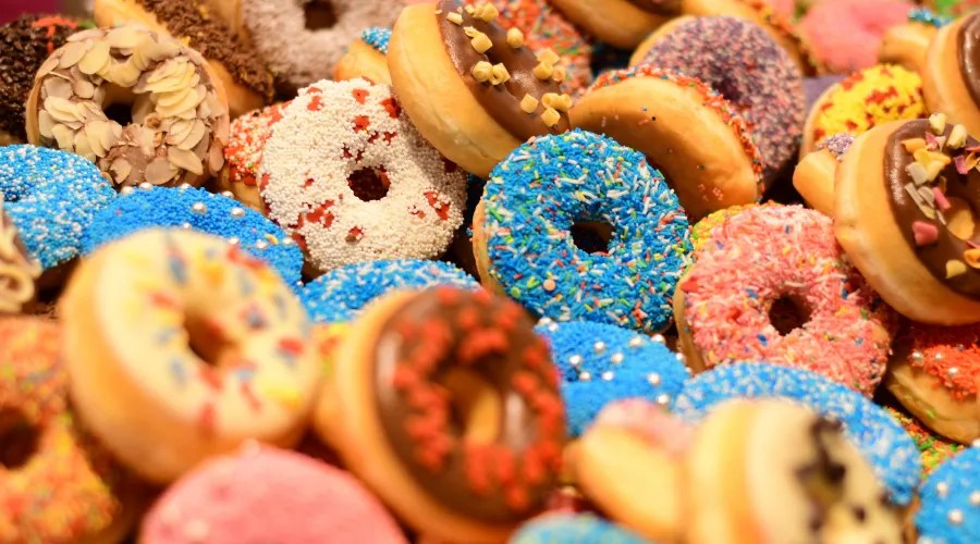 Showcase Full Of Donuts Of Different Colors