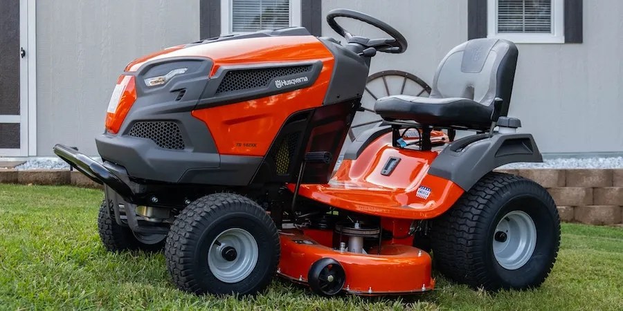 Orange riding mower on a lawn