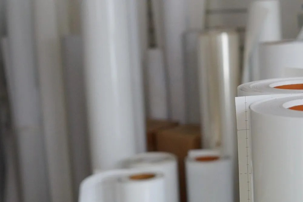 stack of plastic sheet rolls