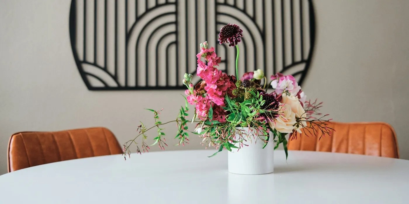 a white table with flower arrangement