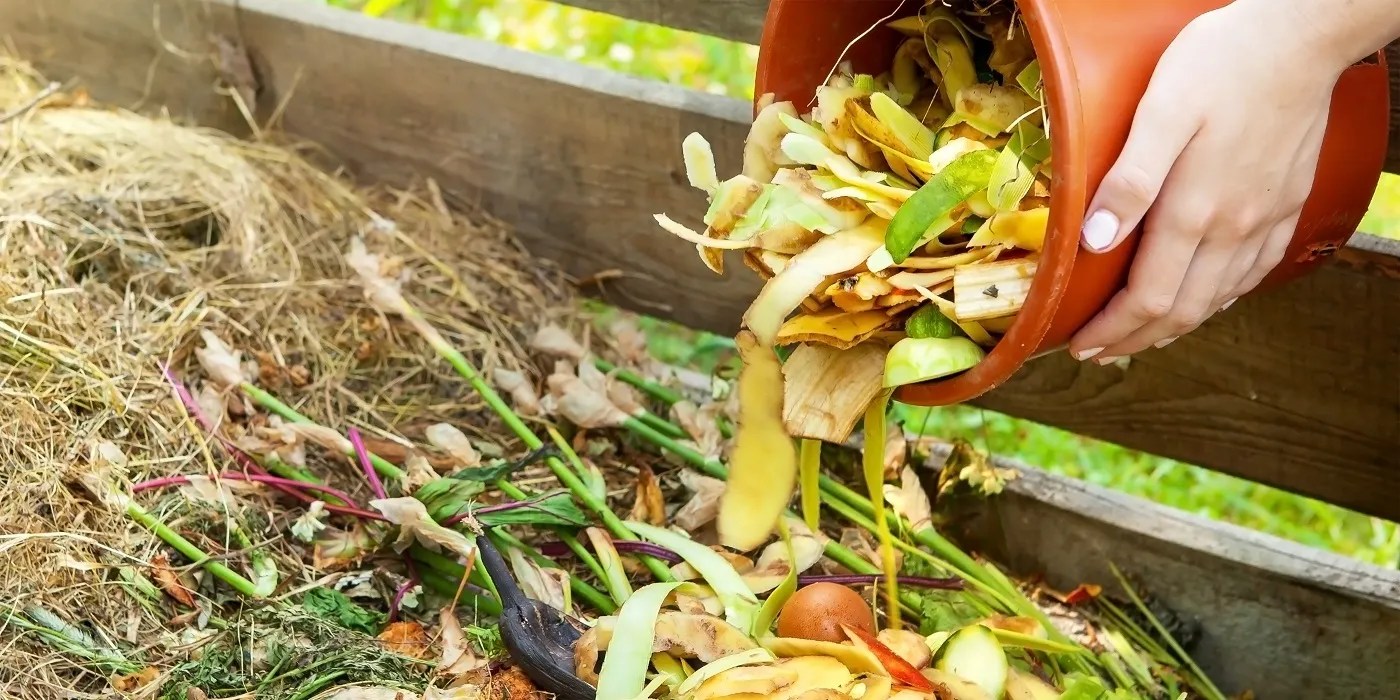 Adding material to the compost bin