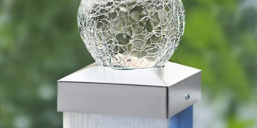 SunnyPark solar post light sitting on top of a white garden post.