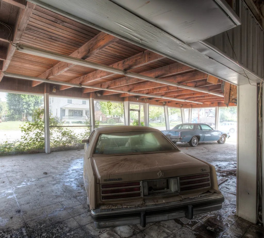 19 Eerie Pictures Of Abandoned Car Dealerships Around The World