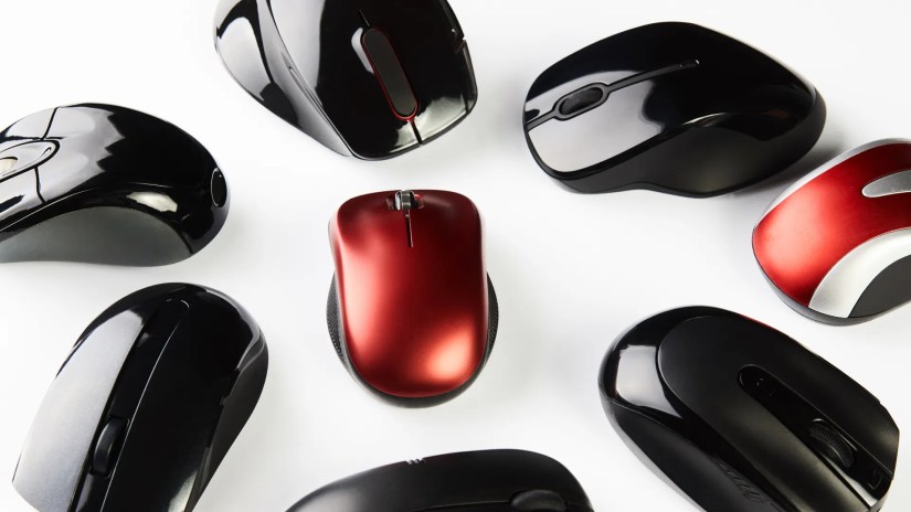 Multiple computer mice on a white surface