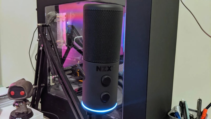 NZXT Capsule microphone on a boom arm in front of a computer.