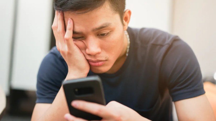Person scrolling on a phone.