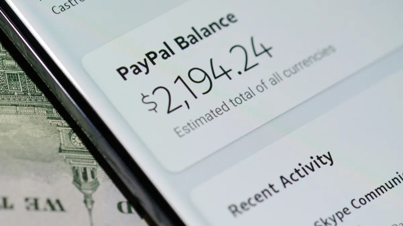Closeup of someone&rsquo;s PayPal balance shown on a smartphone display.
