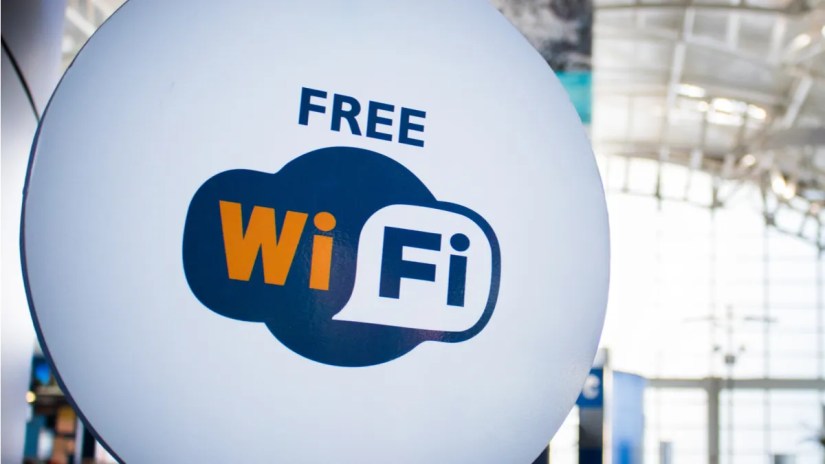 A sign in an airport reading &ldquo;Free Wi-Fi.&quot;