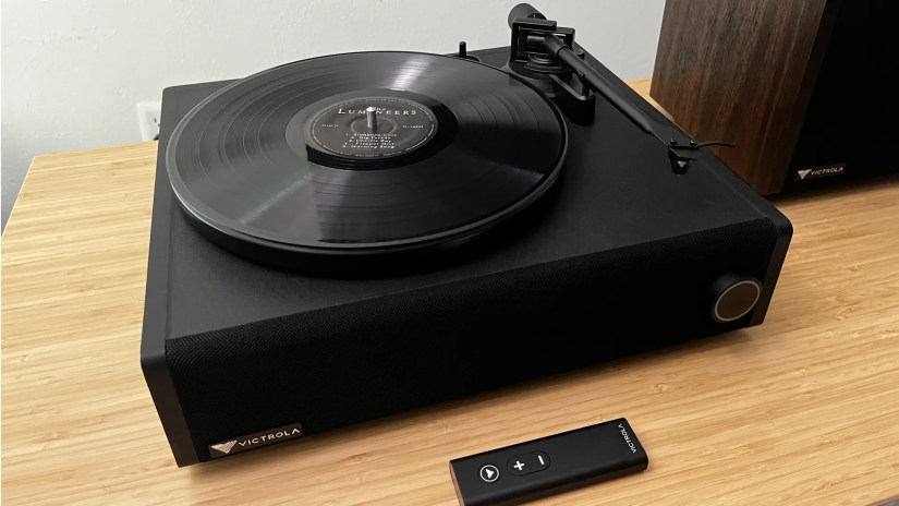 Victrola V1 Soundbar and remote control on table