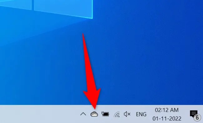Select the OneDrive icon in the system tray.