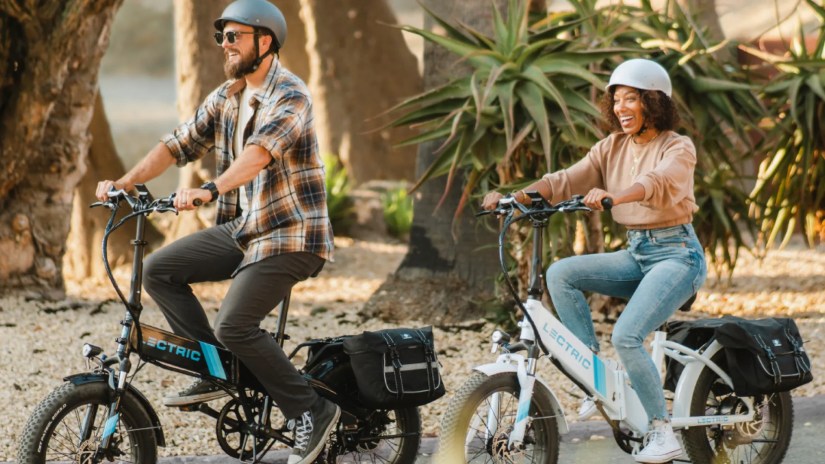 man and woman riding electric bikes