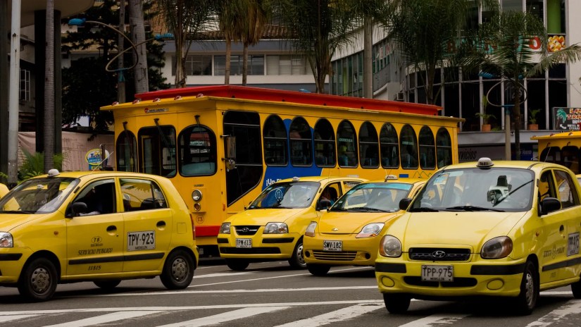 A street full of taxis in Colombia.