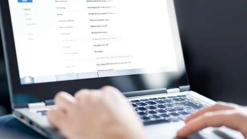 Person viewing their email inbox on a laptop
