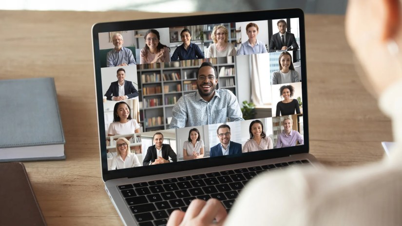 A woman taking a video conference call on a laptop.
