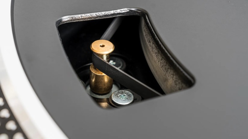 The belt and spindle on a belt-drive turntable.
