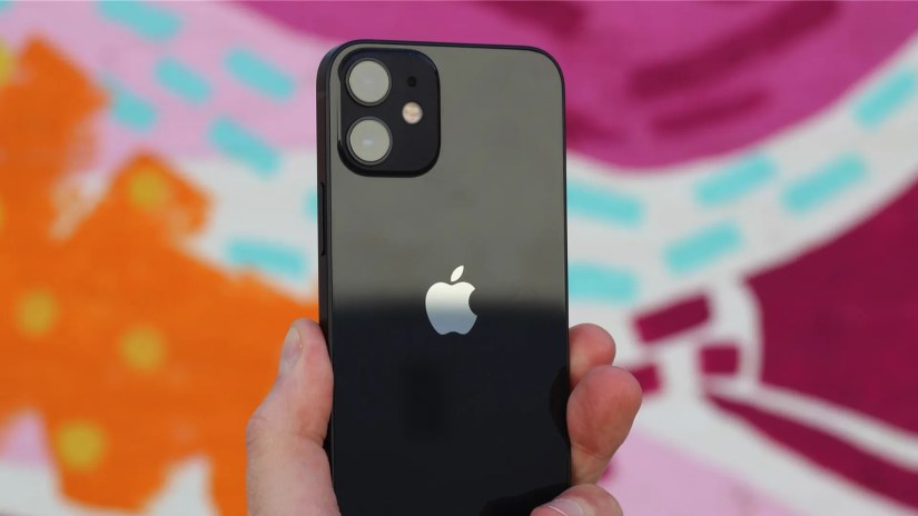 Holding the iPhone 12 Mini