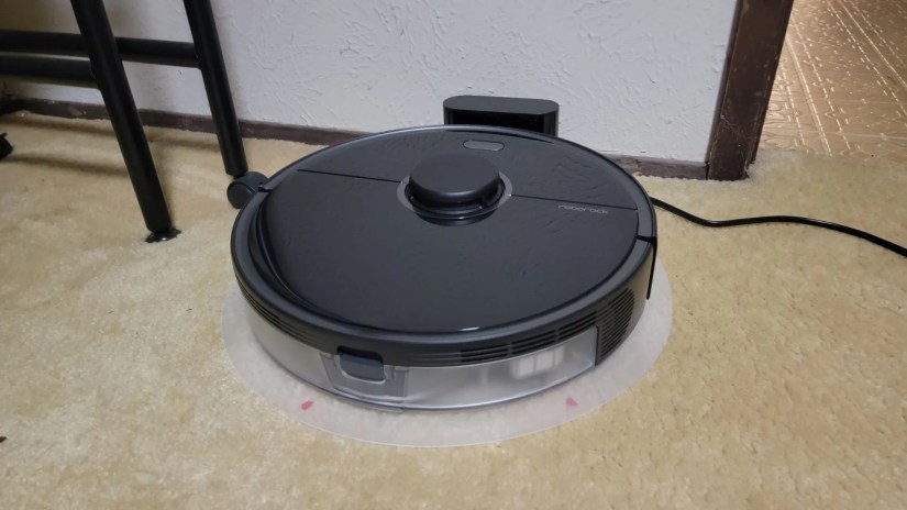 Roborock S5 Max charging near open doorway