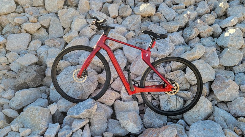 Superstrata bike standing in a rock garden.