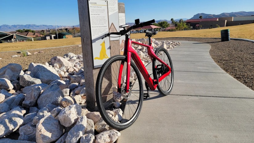 Superstrata ebike leaning on a post
