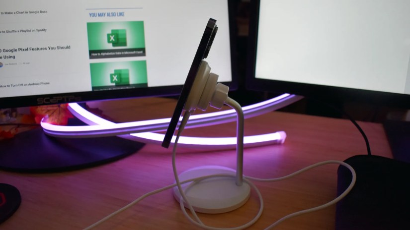 HaloLock Shift Wireless Charger side view with iPhone 14 Pro on charger