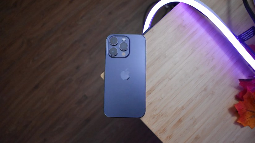 iPhone 14 Pro resting on edge of desk