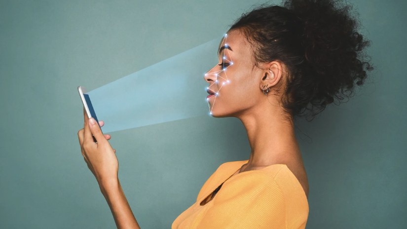 A phone scanning someone&rsquo;s face.