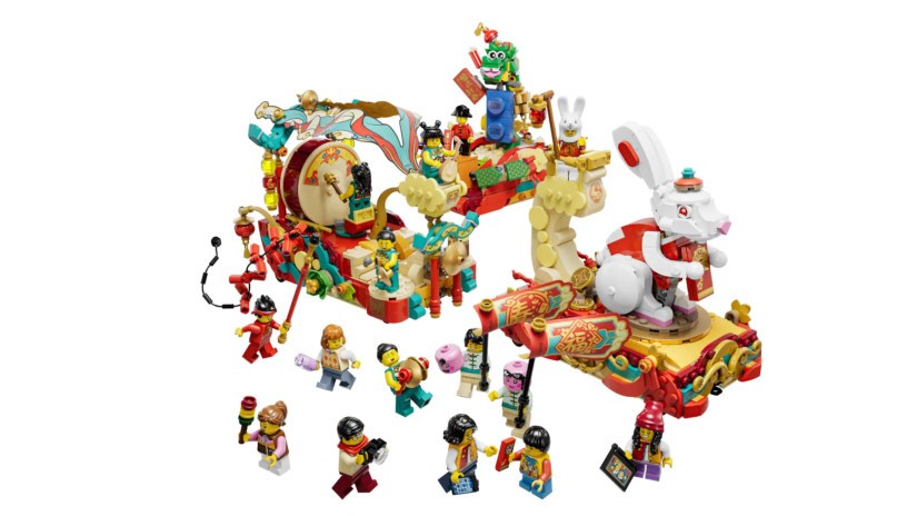 A LEGO model of a Lunar New Year parade sits on a white background.