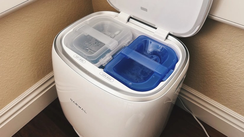 Inside the docking station are two buckets for clean and dirty water.