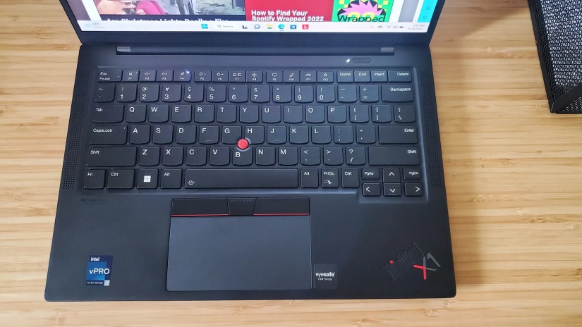 The Lenovo ThinkPad X1 Carbon laptop&rsquo;s keyboard on a desk.