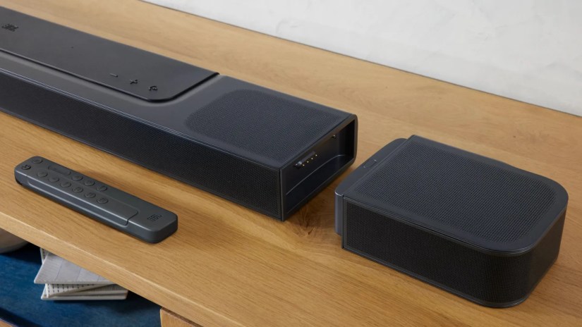 JBL Bar speaker on a wooden table.