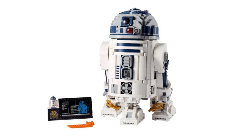 A LEGO model of R2-D2 sits against a white background.