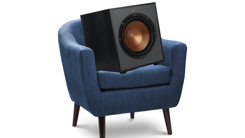 A subwoofer sitting in an armchair.