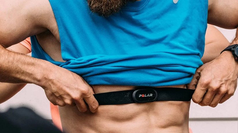 Person putting on Polar 10 heart sensor