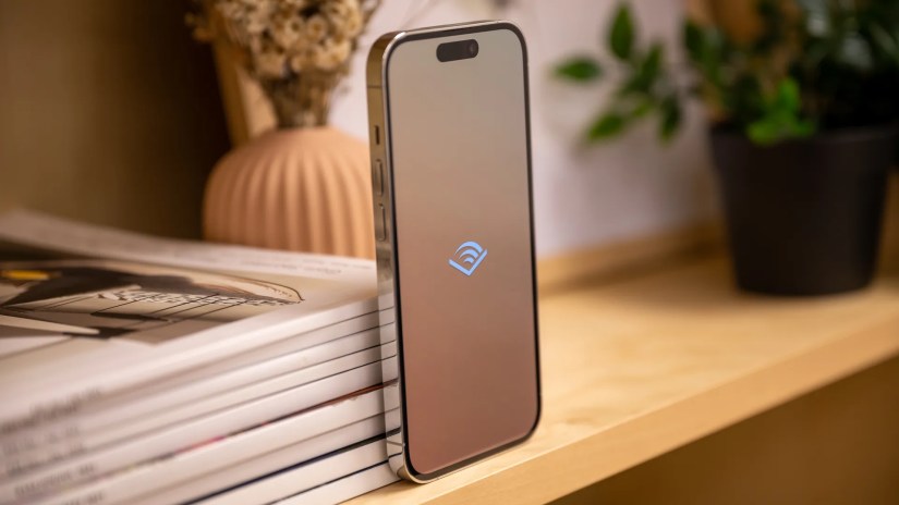 Left side of the Apple iPhone 14 Pro with the Audible logo on the screen.