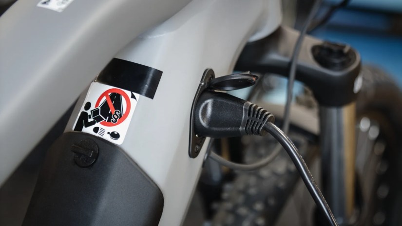 electric bike plugged in and charging.