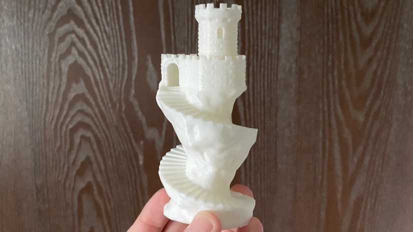 A 3D printed castle tower with spiral staircase.