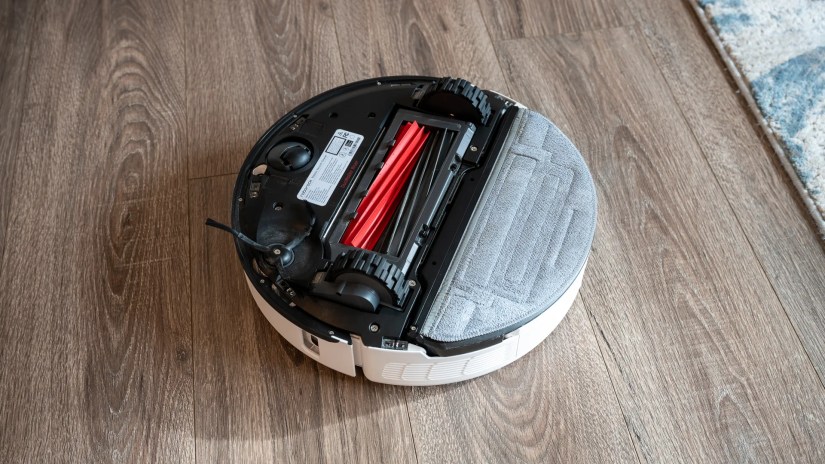 Under side of the Roborock S8 Pro Ultra with its brushes and mop exposed