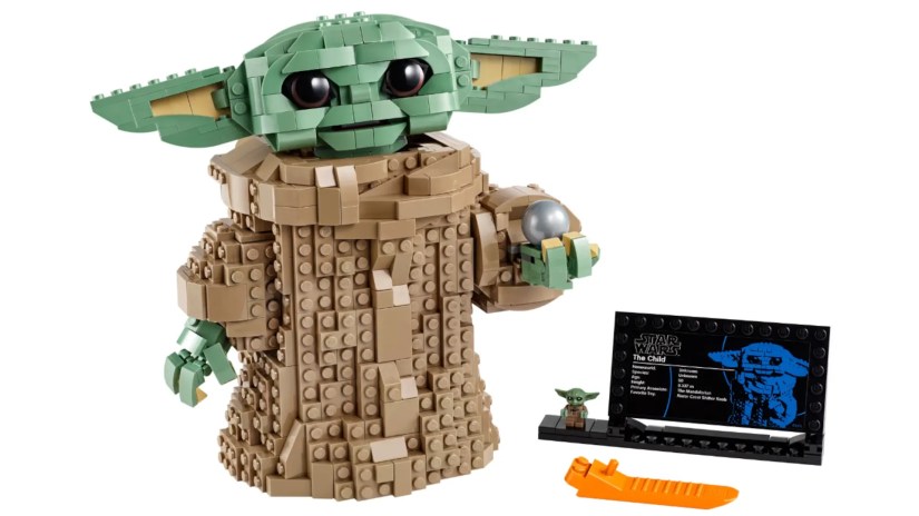 A LEGO model of The Child aka Baby Yoda stands by accessories.