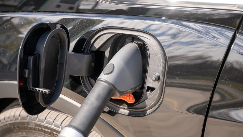 Electrify America charger plugged into a 2023 Chevy Bolt EV.
