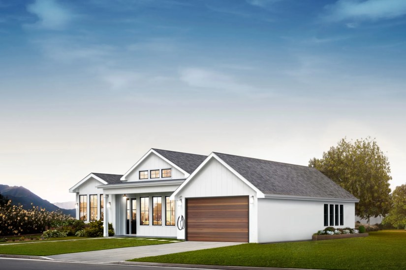 A home with Tesla&rsquo;s universal charger installed outside.