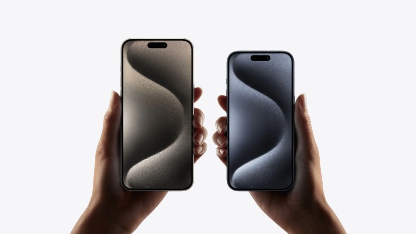 Showing hands holding each of the iPhone 15 Pro models