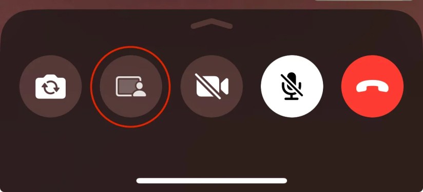 Tap the screen sharing button which looks like a computer screen with a person in front of it on the WhatsApp for iPhone app