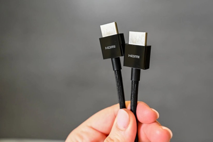 Person holding an HDMI cable