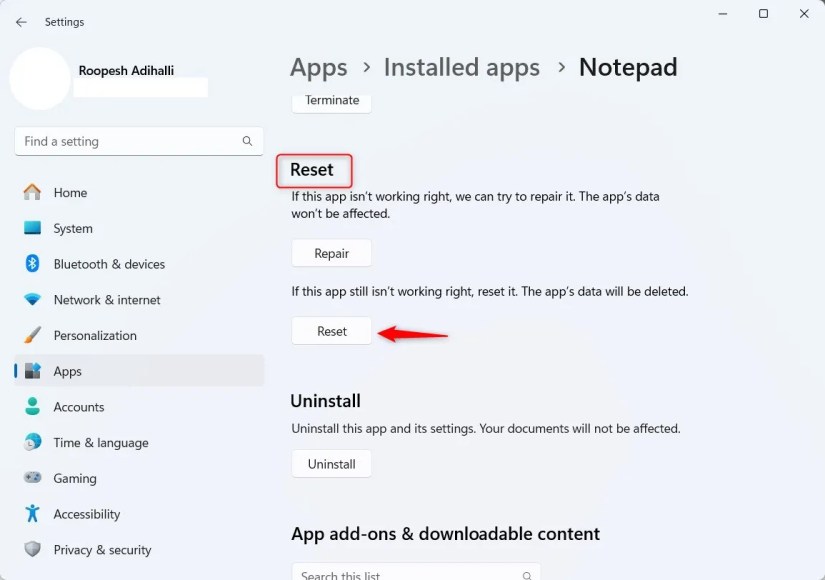 Windows 11 Installed Apps Notepad section highlighting Reset button.