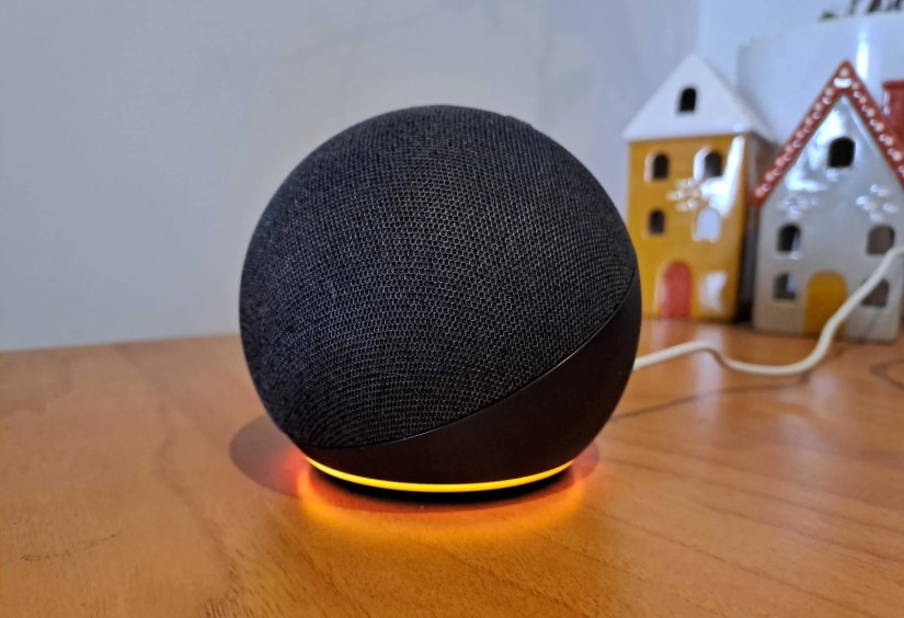 Photo of Echo speaker with orange light.