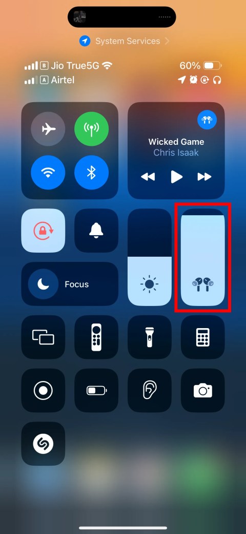 iOS Control Center with volume slider highlighted.